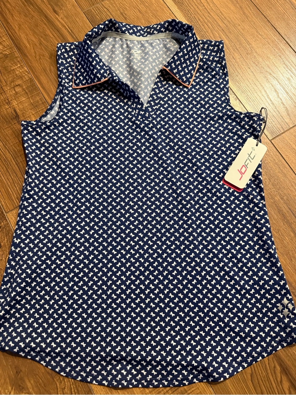 JoFit Navy Golf style Top with White pattern and peach colored ribbing